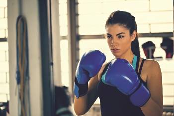 Young women boxing with gloves on