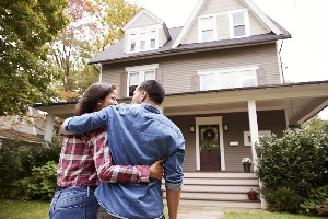 happy couple selling house