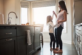 stay at home mom in the kitchen with daughter