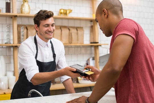 Business owner accepting credit card payments